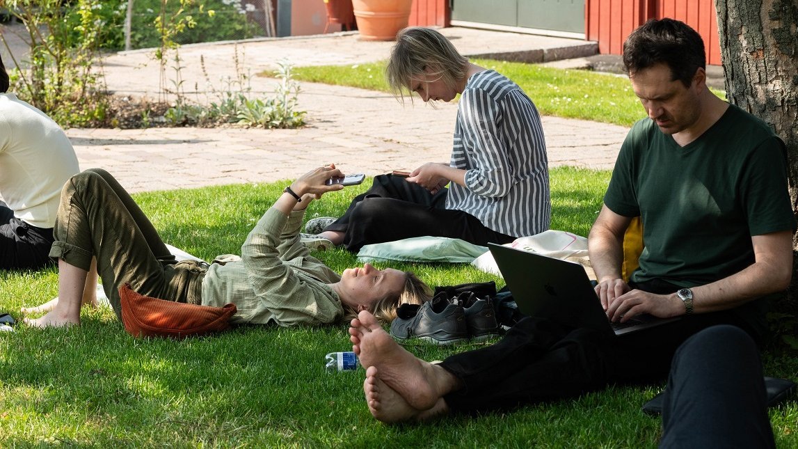 Three translators relaxing at DLL Summer School June 2025